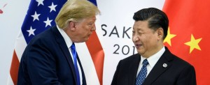 China's President Xi Jinping (R) shakes hands with US President Donald Trump before a bilateral meeting on the sidelines of the G20 Summit in Osaka on June 29, 2019. (Photo by Brendan Smialowski / AFP)